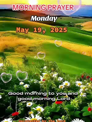 The image is a vertical composition with a vibrant natural scene. The foreground is filled with greenery, including grass and various flowers like daisies and red blooms. In the midground, there's a lush, green landscape with rolling hills, and in the background, there are more distant hills, suggesting a wide-open space. The sky is warm, with hues of orange and pink from a sunrise or sunset, and there are light-blue heart-shaped overlays scattered across the image. Text overlays are present at the top, indicating it's a 'MORNING PRAYER', along with the day and date. The image has a soft, inviting feel due to the colors and the natural setting.
