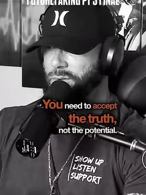 A black and white image featuring a man with a beard and a baseball cap, wearing headphones and holding a microphone. Text is overlaid on the image.