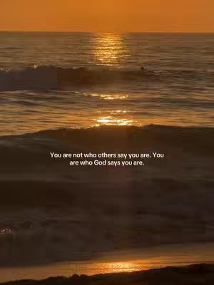 A serene ocean scene at sunset. The water reflects the warm orange and yellow tones of the sky, with gentle waves creating texture. The text overlay, in white, is centered near the bottom against the water.