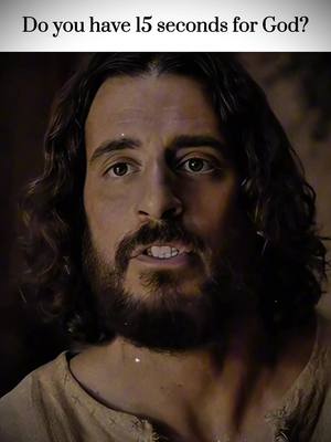 A close-up shot of a man resembling Jesus with long hair and a beard, looking directly at the viewer with a slight smile. Text overlays the image asking if the viewer has 15 seconds for God.