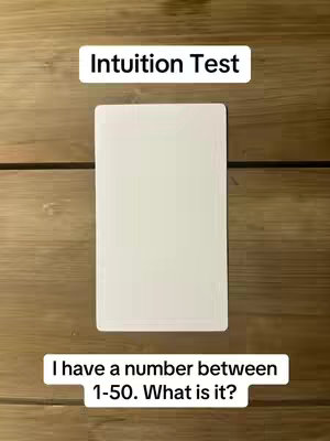 The cover image shows a wooden background where two white rectangles are overlaid. One rectangle contains the words 'Intuition Test'. The other rectangle states, 'I have a number between 1-50. What is it?'