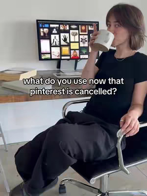A woman sits in a chair, holding a mug and appearing to drink from it, next to a desk. Behind her, a computer monitor displays a collage of images. The image is well-lit and suggests a modern, workspace setting.