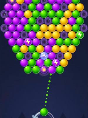 The image displays a vibrant bubble shooter game interface. The primary focus is on a cluster of colorful bubbles (purple, green, yellow) forming a circular shape at the top. A green bubble is being shot from the bottom. The background is a dark blue/purple gradient with some graphic elements at the bottom.