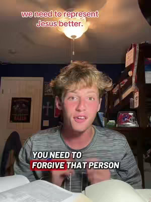 A young man with blonde, curly hair is centered in a room, with text overlays in red and a sign for the organization in the back. He is facing the camera with a slight smile.