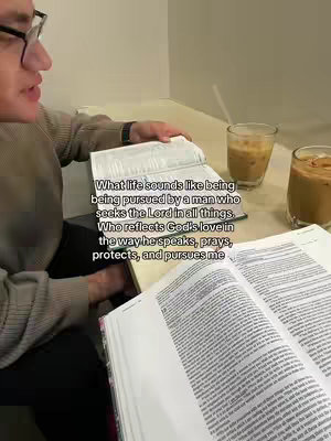 A person wearing glasses is seated at a table with a notebook and a Bible open in front of them. There are two glasses of a blended drink with a straw. The overlaid text explains what life is like when pursued by a man seeking the Lord.