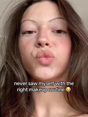 A close-up shot of a young woman's face, with a pouty expression and a text overlay at the bottom. The image is softly lit, highlighting rosy cheeks and a natural skin tone. The background and framing suggest a casual, selfie-style photo.