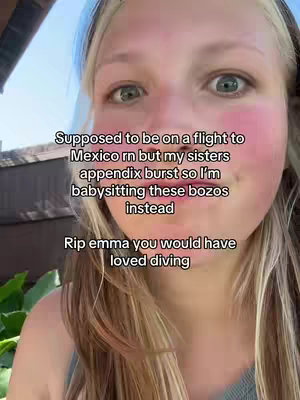 A close-up shot of a young woman's face, looking directly at the camera. Her skin is fair, with a slight pink blush on her cheeks. Her eyes are open wide with a questioning or surprised expression. Her hair is blonde, pulled back from her forehead, and framed. Overlayed text takes up the upper midsection of the frame.
