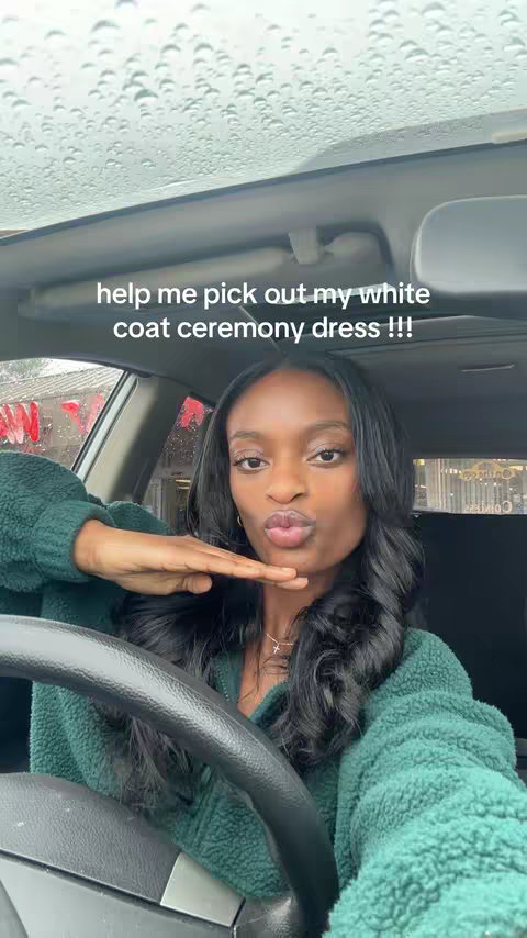A woman with long, wavy black hair is seated inside of a car, holding the steering wheel. She's wearing a green, textured jacket. The car window is up, with visible raindrops. The hook text overlays the image.