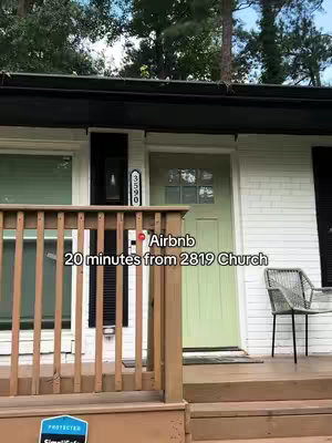 The image shows the exterior of a house. The house has white siding, a green door, and a wooden porch. Text is overlaid on the image, mentioning 'Airbnb' and '20 minutes from 2819 Church'.