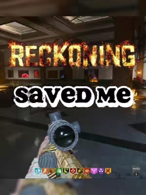 The cover image shows a first-person view of a video game, specifically a Call of Duty: Zombies scene. In the foreground, a gun scope is visible, taking up the majority of the bottom half of the view. The background shows a dimly lit room, possibly a building interior, with text overlays. The text 'RECKONING' appears above 'savedME'. The overall composition suggests a gameplay highlight or a review of the game's elements.