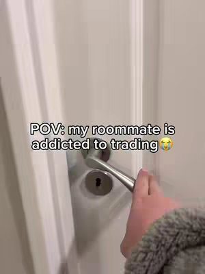 A person is opening a white door, with a hand visible holding the door handle. Overlayed text is present.