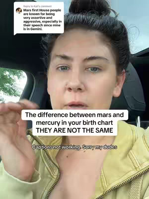 A woman is in a vehicle, seen from the chest up, looking straight at the camera. She has fair skin, dark hair pulled up in a bun, and is wearing a light yellow jacket. A text overlay at the bottom reads a statement about Mars and Mercury in birth charts.