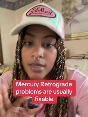 A woman with dark skin and braided hair is the central focus, wearing a white cap with a pink and teal design. She's in a medium shot, against a backdrop of a room with a wall design and a pink top. A red banner overlays the image, with text describing the content's subject.