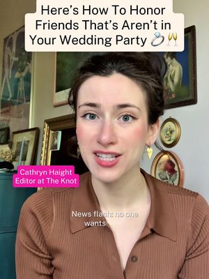 A woman with light skin and dark hair, wearing a brown shirt, is centered in the frame. The background includes framed pictures and decor. Text at the top reads, 'Here's How To Honor Friends That's Aren't in Your Wedding Party.' Additional text at the bottom provides the name and title of presenter. There is a 'News flash' text overlay at the lower center.