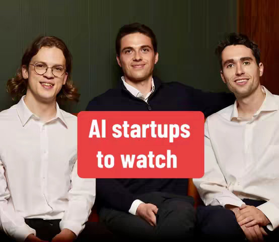 Three young men in white shirts are smiling directly at the camera, positioned in front of a dark green background. A large red rectangle in the center contains white text that reads, "AI startups to watch."