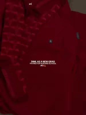 The cover image displays a vertically oriented shot, predominantly featuring the upper torso of a person dressed in a deep burgundy scrub top. The texture appears smooth, with subtle shadows that give depth to the fabric. Positioned at the center and lower part of the image, a text overlay in white font with a dark background, features the phrase "DIML AS A NEW GRAD PAYING FOR NURSING SCHOOL" followed by some emojiis. Overall the image has a clean and modern aesthetic.