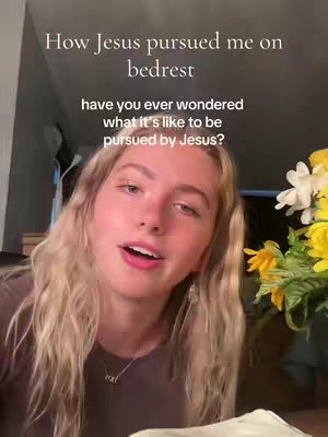 The cover image is a selfie-style shot featuring a young blonde woman with shoulder-length wavy hair. She is positioned slightly off-center, looking towards the camera with an open mouth, suggesting she is speaking. The background is softly focused, including elements of a room with a glimpse of a plant with yellow and white flowers. Text overlays on the top part of the image in a simple, sans-serif font, with the most prominent saying: 'How Jesus pursued me on bedrest'.