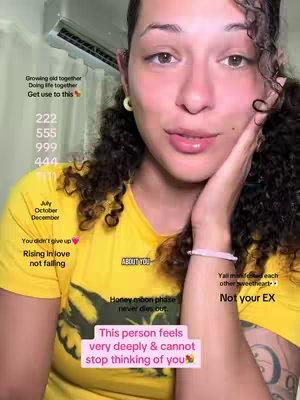 A woman with dark curly hair and a yellow shirt is smiling and holding her hand up to her face. Text overlays appear on the image in varying sizes and colors.
