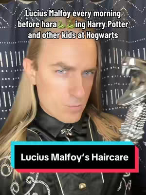 A close-up shot showcasing a person dressed as Lucius Malfoy from the Harry Potter series. The person, with long blonde hair and a stern expression, looks towards the camera. The background is a dark curtain with a repeating white pattern. A silver object, resembling a wand or a hair styling tool, is held close to the right side of the frame. Text overlays are placed on the image, identifying the character and the context of the video.