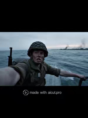 A man in a military helmet is seated in a small boat, appearing distressed. The background shows a cloudy sky and water with a faint outline of a warship. The bottom of the frame displays a watermark.