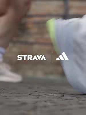 The image shows a close-up of a running shoe, with the focus on the sole. The Strava and Adidas logos are overlaid.