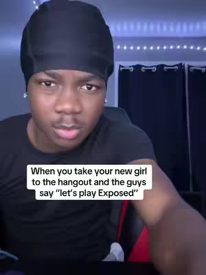 A selfie-style shot of a young Black man wearing a black durag, gazing towards the camera with a somewhat concerned expression. Text in a white rectangular box reads, 'When you take your new girl to the hangout and the guys say "let's play Exposed"'. The background is a dimly lit room with blue and purple lighting effects.