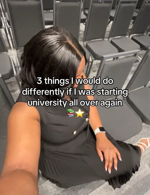 An overhead shot shows a person seated in a room with rows of chairs. The person, likely the creator, is wearing a black dress and white shoes. Overlaid text provides the video's hook.