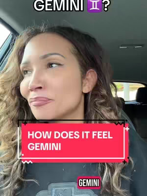 A woman with long, wavy brown hair is positioned in front of a red banner that says 'HOW DOES IT FEEL GEMINI' in white text.