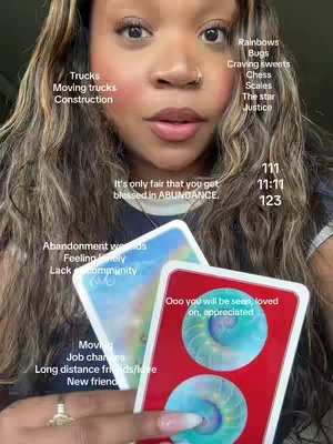 A woman with dark hair and a neutral expression is holding two tarot cards, with additional text overlays around her face. The overall composition uses a soft lighting and a close-up perspective.