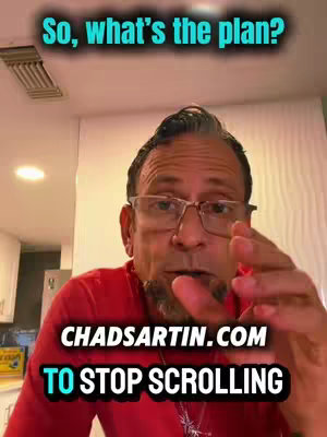 A selfie-style shot featuring a man in glasses, looking directly at the camera and speaking. Text overlays include a question in a turquoise box in the top left, and white text with a black outline at the bottom, mentioning a website and asking viewers to stop scrolling, all over a red shirt. The setting appears to be indoors, likely a home.