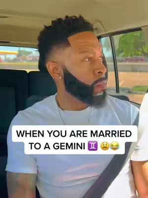 A man is seated in a car, glancing to his right with a look of surprise or exasperation. Text overlaid includes a humorous statement about being married to a Gemini.