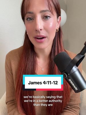 A medium shot of a woman with auburn hair and a brown sweater, speaking directly into the camera. A microphone and the top of a speaker are on the right side of the frame. Overlayed on the bottom is a text box with the text "James 4:11-12" and additional text. The background is a plain white wall.
