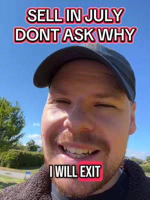 A man with fair skin, a short beard, and a black cap smiles at the camera, set against a bright blue sky. Text overlays include the phrases "SELL IN JULY DON'T ASK WHY" in a rounded sans-serif font with pink and an inner red stroke, and "I WILL EXIT" in a white sans-serif font with a red background.