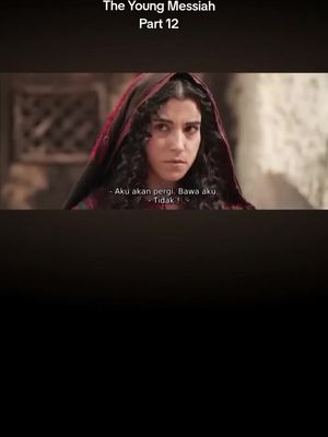 The cover image is from a movie scene with a woman as the central focus. She is wearing a dark veil or head covering, with deep red accents visible. Her expression is intense, with a serious look. The background shows a glimpse of an aged building adding to a historical setting.