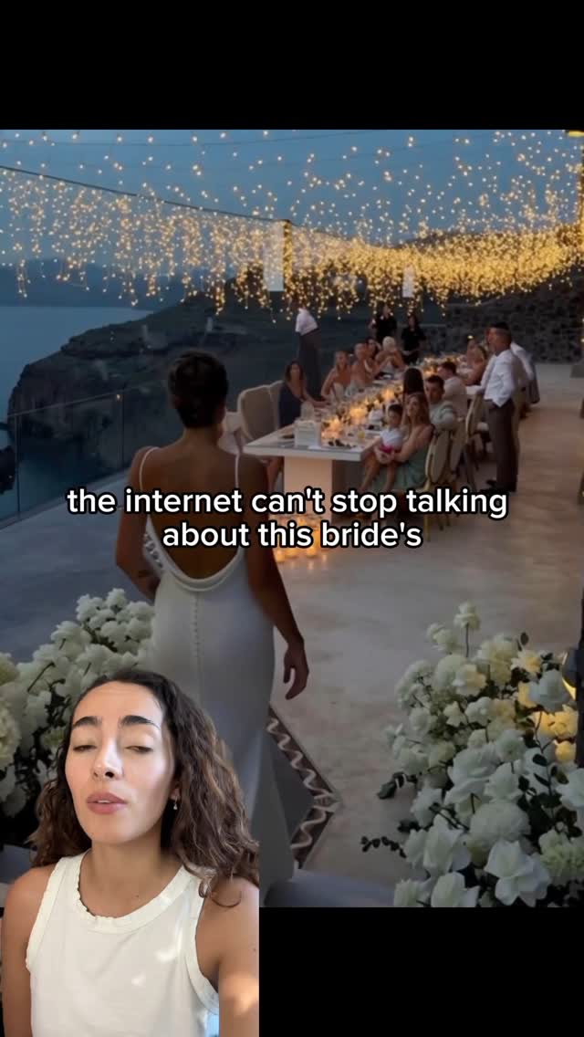 The cover image displays a woman in a white top in the foreground on the left. The woman is speaking. In the background, the main focus is on a wedding reception. The background has tables set for dining, with guests seated at the tables, and the sea in the background. There is text overlayed on the image: 'the internet can't stop talking about this bride's'.
