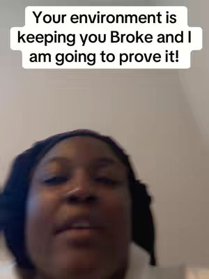 A selfie-style video cover with a light-skinned Black woman as the main focus. The woman is wearing a black head covering. Above her head, in a slightly curved white text box, the text reads: Your environment is keeping you Broke and I am going to prove it!