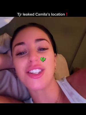A selfie-style shot with a young woman looking directly at the camera. The background is blurred, suggesting an indoor setting. There is superimposed text at the top describing something that occurred and a logo on the face. The woman is wearing a white tank top. The overall composition suggests an informal, personal context.