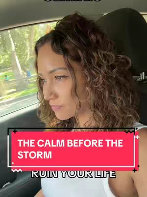 The cover image shows a woman seated in a car, gazing off to the side with a thoughtful expression. She has curly brown hair. A red rectangular overlay at the bottom displays the text: 'THE CALM BEFORE THE STORM' followed by 'RUIN YOUR LIFE'.