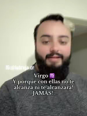 A man with a beard and gray t-shirt is centered in the frame. Text overlays describe an astrological sign. The background is a plain wall.