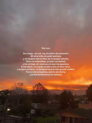 An image of a vibrant sunset over a landscape with a poem overlayed in white text. The sky is a blend of orange, red, and gray, suggesting dusk or dawn. Below the horizon, there's a line of trees or a silhouette of land. The poem describes being a Leo.