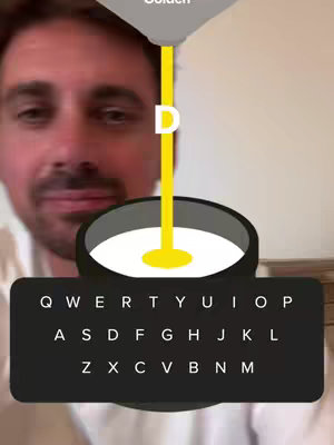 A selfie-style image featuring a man's face in the foreground with a game-like interface overlaid. Above his head is a graphic that says Golden. A yellow stream flows from this to a container below where an animated white liquid sits. Below that is a virtual keyboard interface. The background is a plain light wall.
