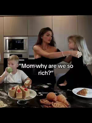 A woman and two children are in a kitchen, with various pastries and baked goods on the table. The woman is dressed in a black dress, and the text overlay reads 'Mom why are we so rich?'.