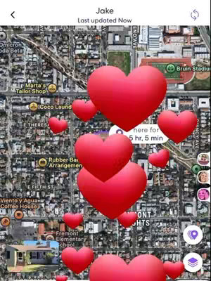 The cover image is a screen capture from a Life360 app, showing a map with a street view. The map is a aerial image of a neighborhood, with several red heart-shaped icons scattered over it, overlaying the map's details. The app interface includes the user's name at the top, along with several location related details, as well as the profile photos of people nearby. The overall impression is a vibrant, visually appealing composition that aims to communicate love and connections.