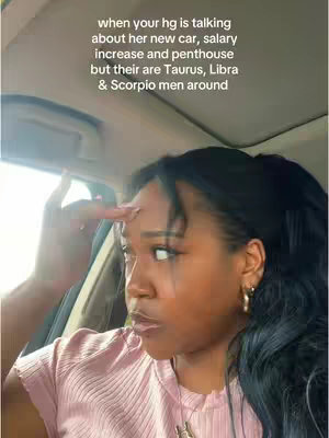 A woman in a car looks to the side, hand to her forehead in a thinking gesture. Text overlays the scene.
