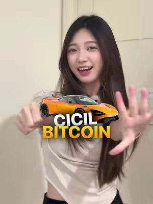 The cover image features a young woman centered in the frame, smiling with her mouth open and hands outstretched. She is holding a toy car in front of her. Overlayed on the image is the text 'CICIL BITCOIN' in a yellow and black rectangular box.