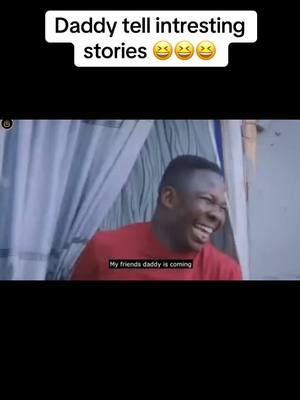 A man in a red shirt laughs heartily. Above his head, a white bar contains the text "Daddy tell intresting stories" with laughing emojis. The background shows glimpses of a curtain or draped fabric.