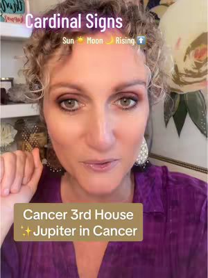 The cover image features a woman with curly hair, set against a softly lit background. She directly faces the camera, with a background that suggests a cozy setting. The color palette is warm, with hints of pink and gold that complement her complexion and attire. Overlaid text frames the subject with astrological information, the composition balances informal subject matter with a clean layout.