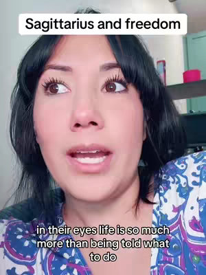 A medium shot of a woman with dark hair looking up and slightly to the left with an open mouth. Overlaid text says, "Sagittarius and freedom" at the top of the frame and the quote "in their eyes life is so much more than being told what to do" at the bottom.