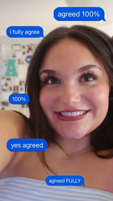 A medium shot features a smiling young woman with long, dark hair, looking directly at the camera. She has visible eyelashes, and her skin has a natural tone without heavy makeup. Various text bubbles with text overlay are scattered around her face. The background is slightly blurred, suggesting an indoor setting, possibly a bedroom.
