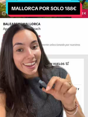 A woman smiles while holding a microphone in front of a travel website screenshot. A text overlay at the top reads 'MALLORCA POR SOLO 188€'. The website screenshot shows travel details with the words 'BALEARES MALLORCA'.